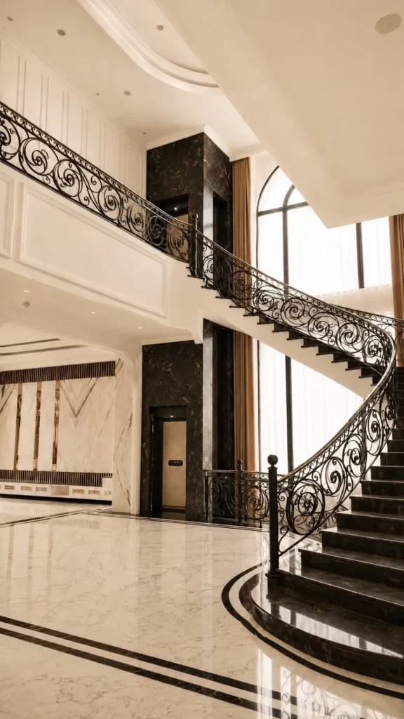 Checklist Pasang Lift Rumah: 15 Hal Penting 6 Kalea home lift (X-30 - Premium) terintegrasi di samping tangga melengkung pada rumah bertingkat